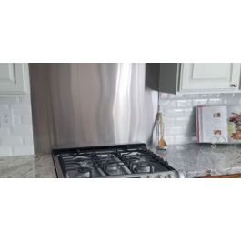 Currents Stainless Steel Kitchen Backsplash 24 x 30 - Beautiful, all  stainless steel range backsplash with an engraved Currents pattern.  Available